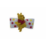 winnie the pooh on a white grosgain bow with red and yellow polka dots